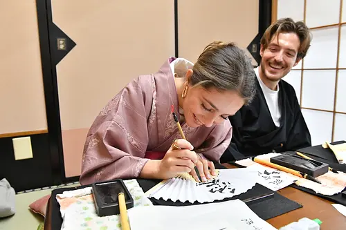 Learning Japanese Zen Calligraphy in Kimono by Osaka Castle
